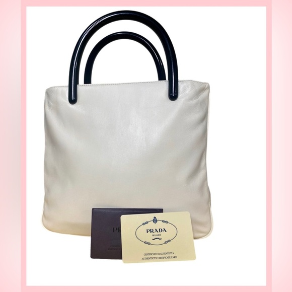Prada Handbags - Prada White Tote Bag with Sleek Design
